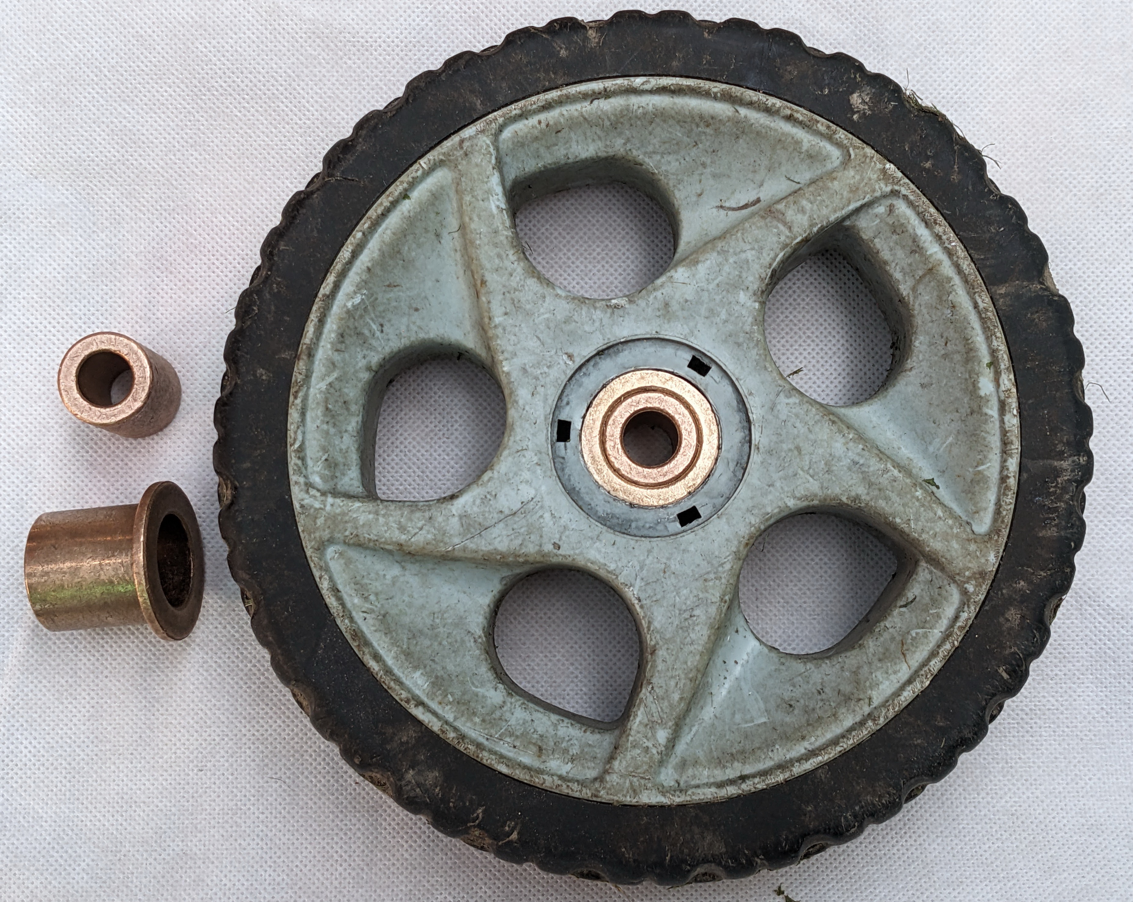 Mower wheel with bronze bushings